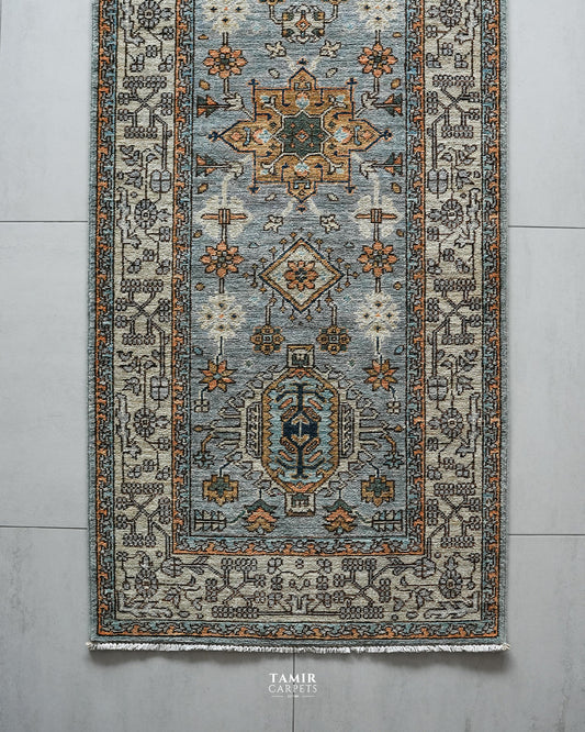 Top section of the Chobi Runner showing medallions and the ivory border