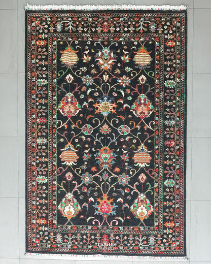 Sultani black base Afghan handmade wool rug 5.5x8 ft