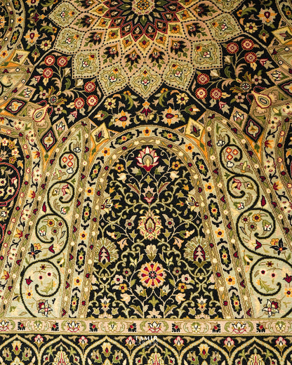 An ornate Persian-style rug with intricate floral and geometric patterns in black, beige, green, and red.