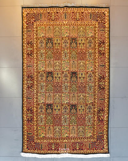 Bakhtiari Black Persian wool rug 6x9 ft, full view of the red and gold garden-panel design