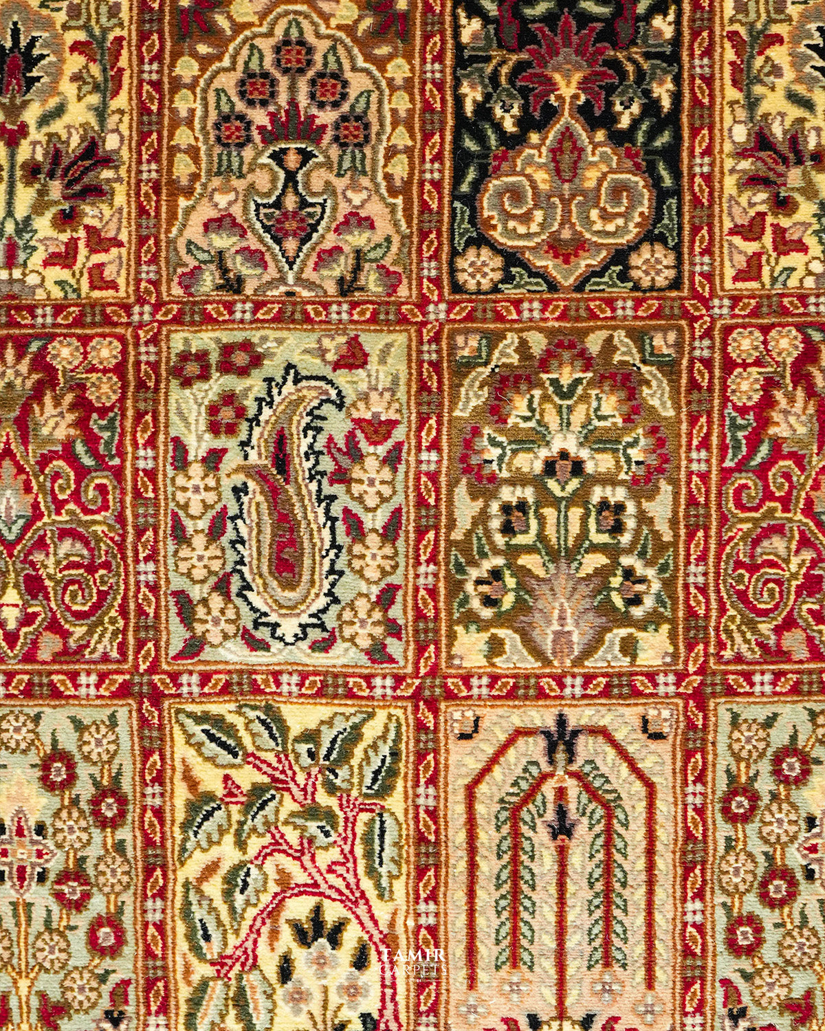 Close-up of paisley, cypress and floral panels on the Bakhtiari Black rug