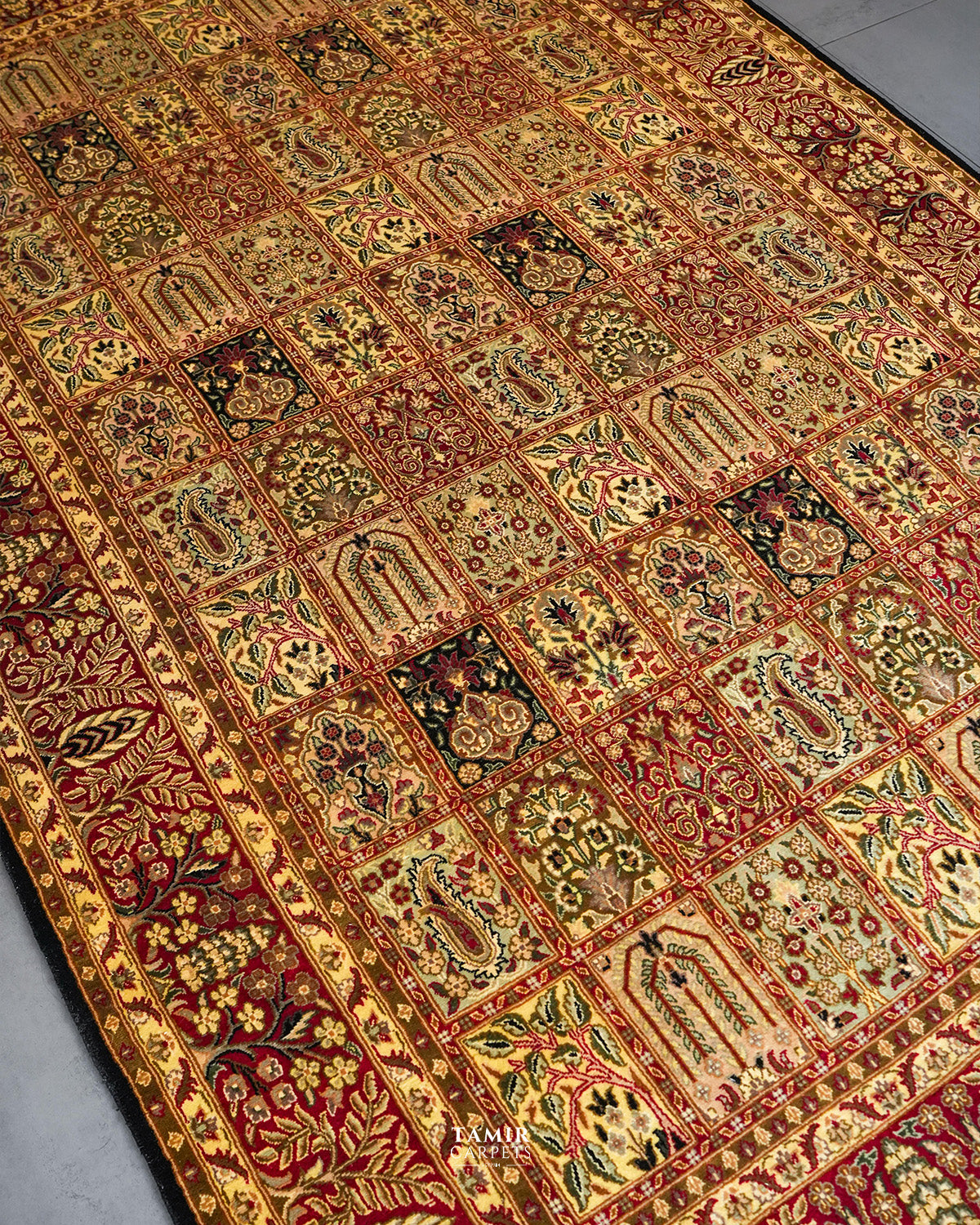 Angled view of the tiled garden panels on the Bakhtiari Black 6x9 Persian rug
