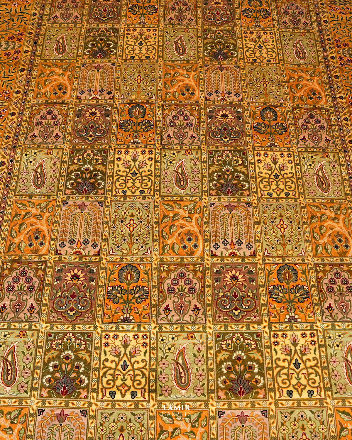 Panelled field of the Bakhtiari Mustard rug with floral and cypress motifs
