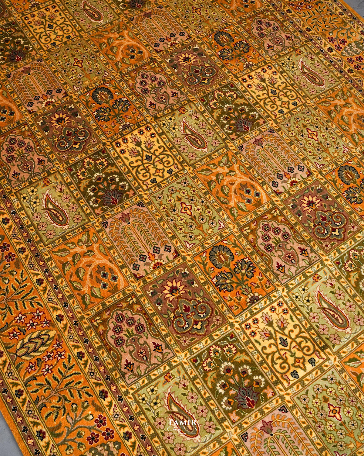 Angled view of the mustard Bakhtiari rug's tiled garden pattern