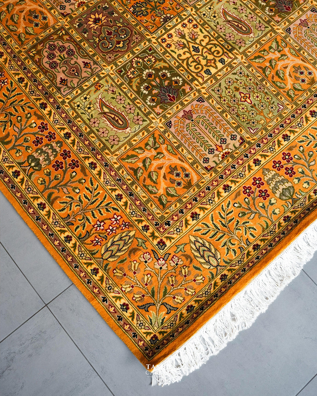 Floral border and fringe detail of the handmade Bakhtiari Mustard rug