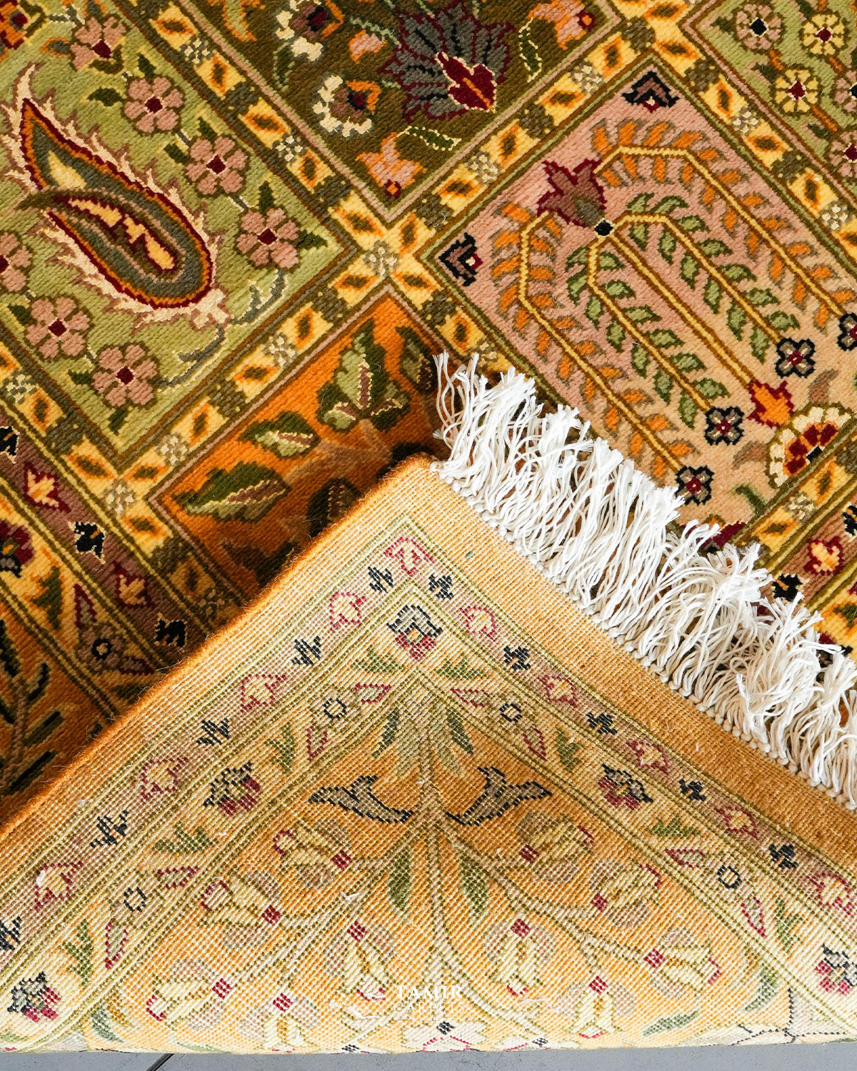 Folded corner showing the back weave of the double-knotted Bakhtiari rug