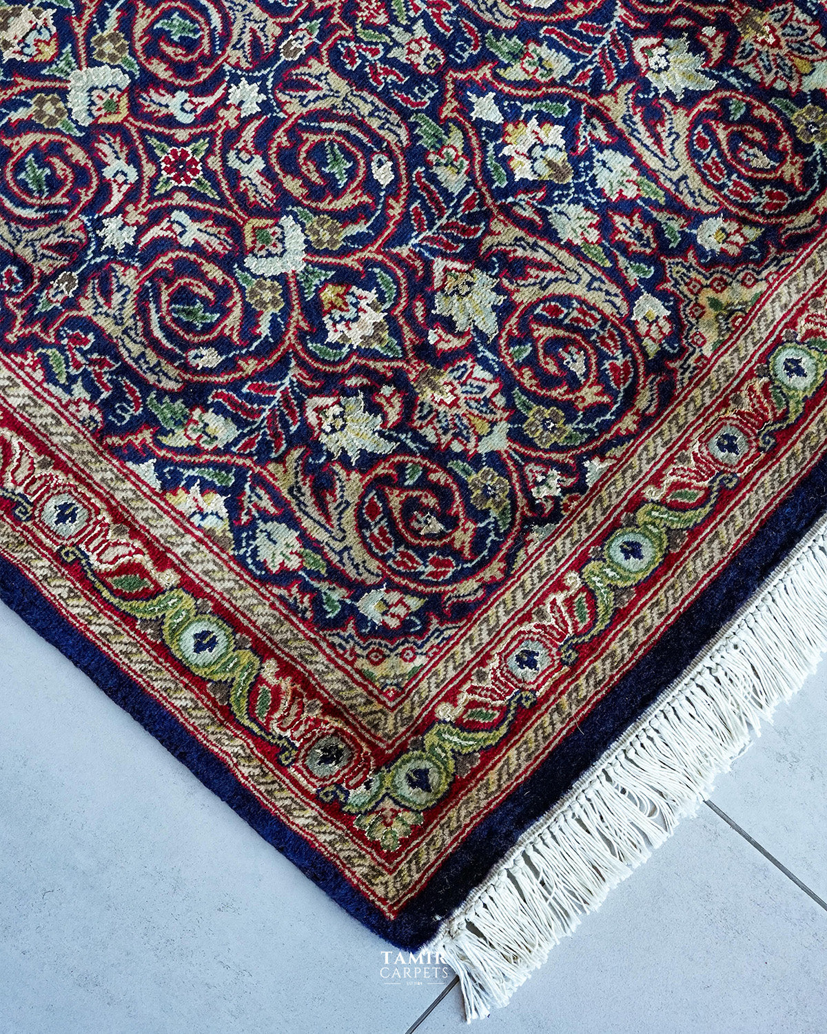 Corner of the Bakhtiari Runner showing the red and gold border with fringe
