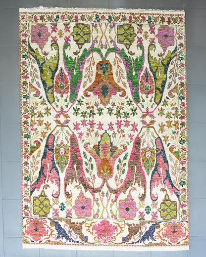 Bidjaar 9x12 ft handmade ivory wool rug with pink, green and navy floral palmettes, full view