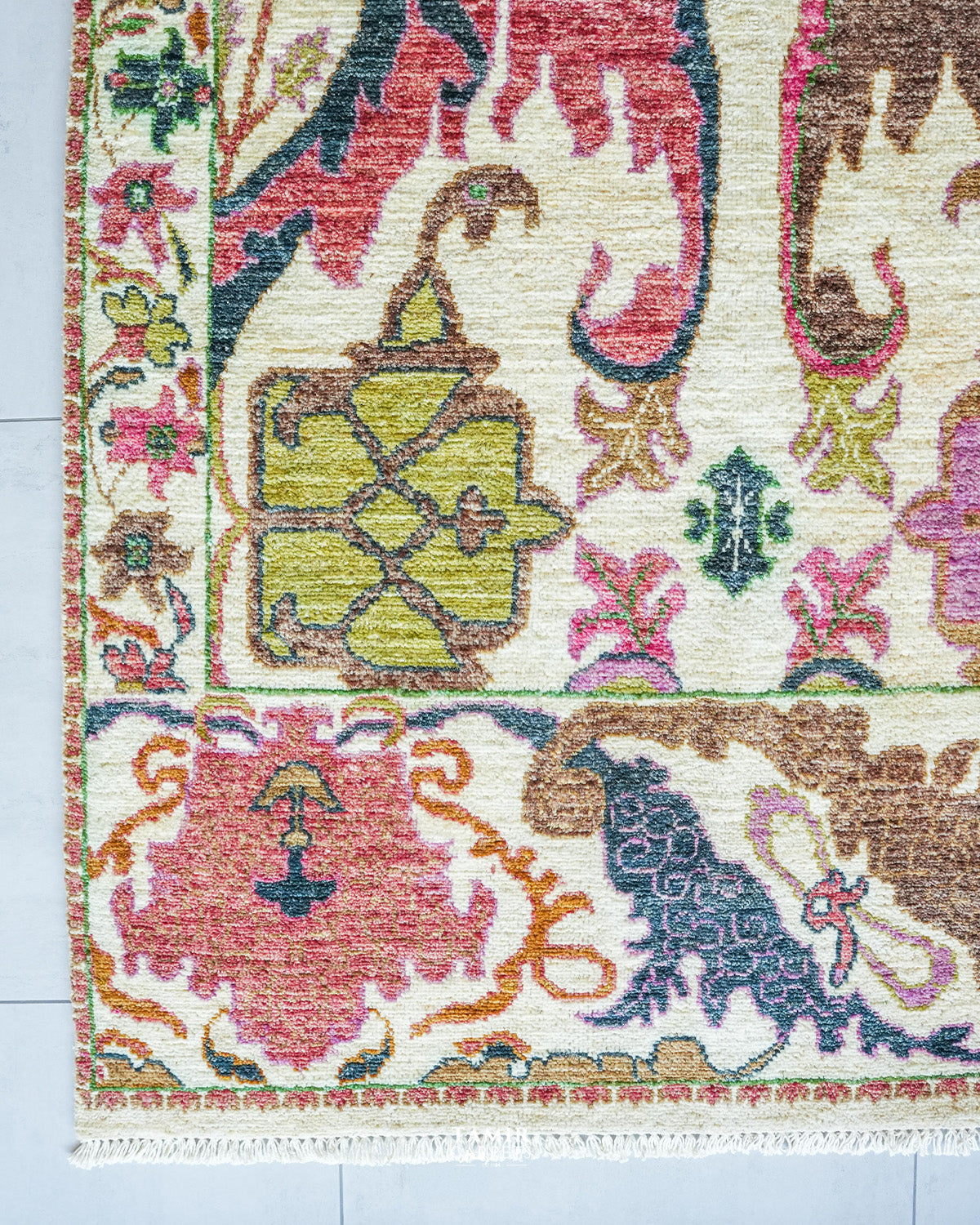 Bidjaar 9x12 rug angled view showing ivory field and multi-band floral border