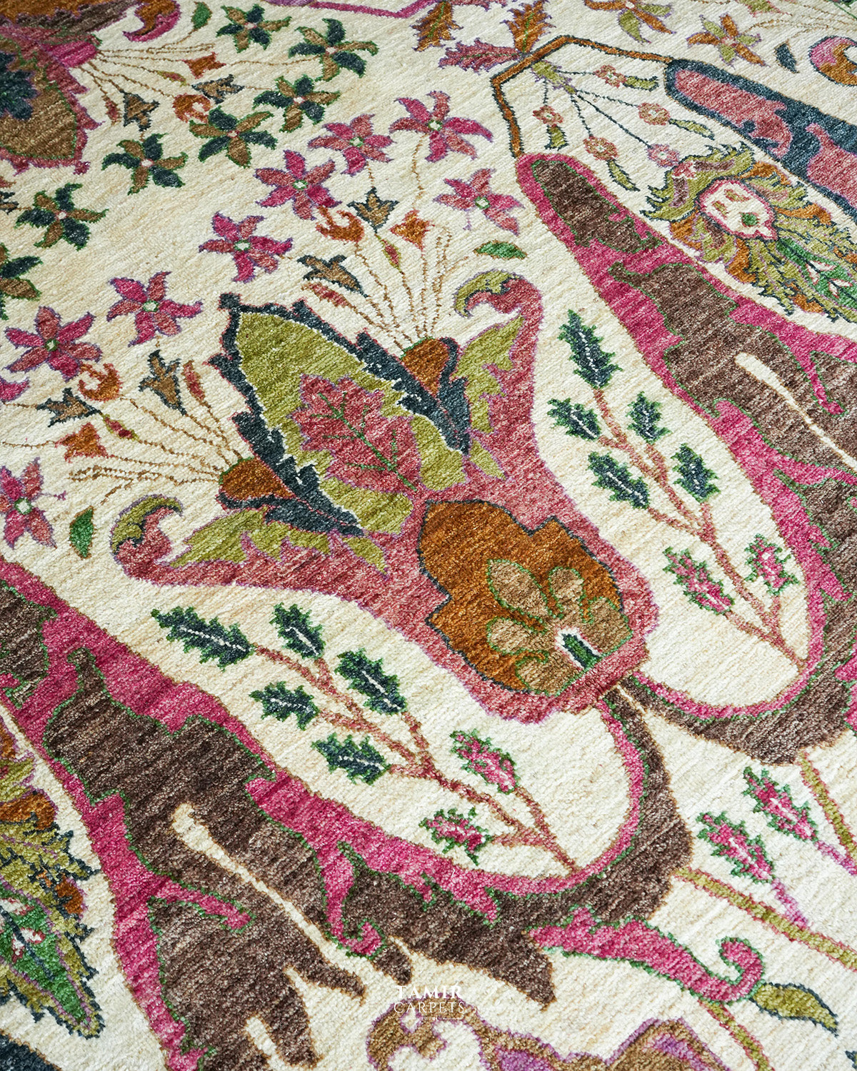 Bidjaar rug border detail with navy, rust and green floral motifs