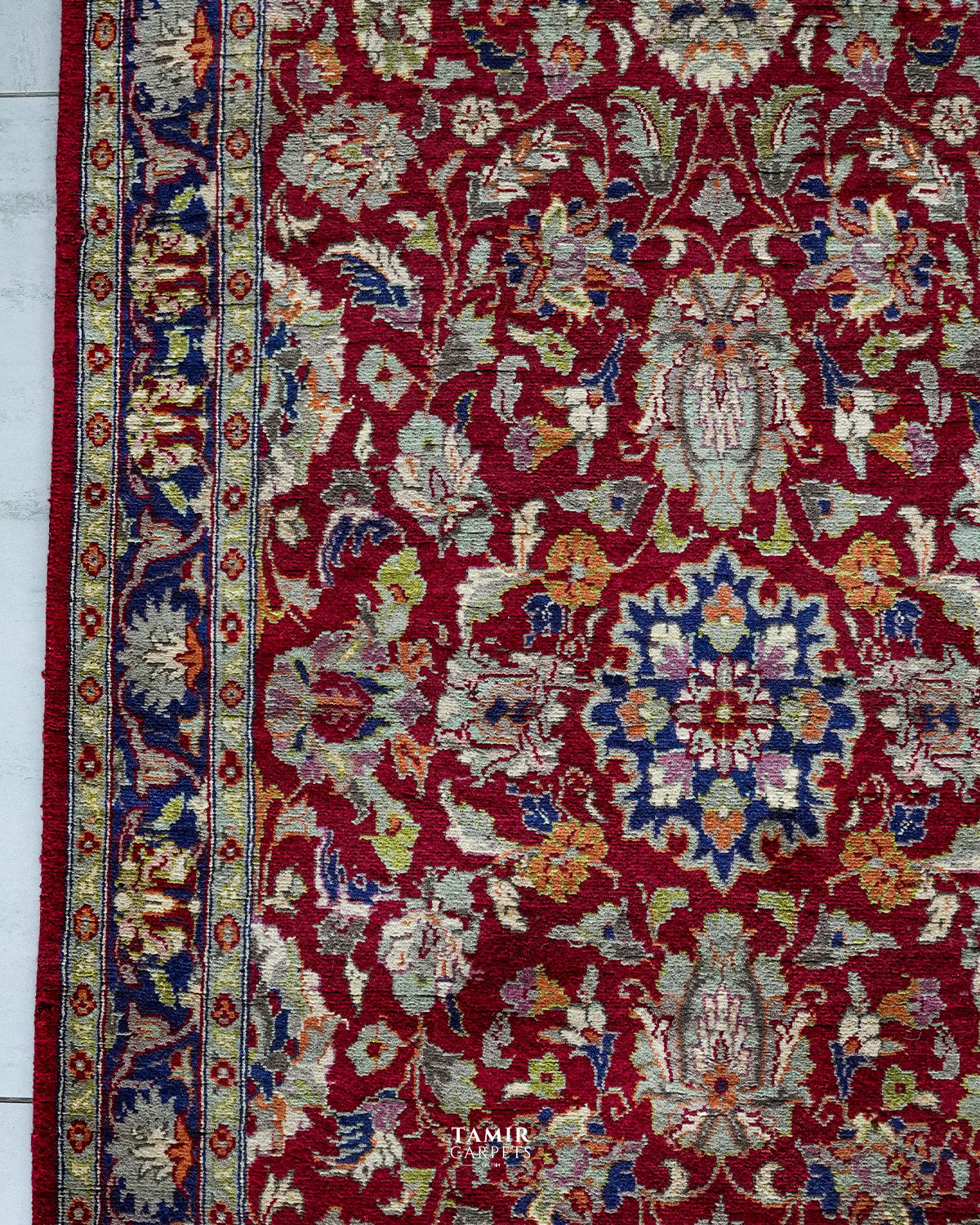 Central navy medallion and red floral field of the Chobi 3x5 rug