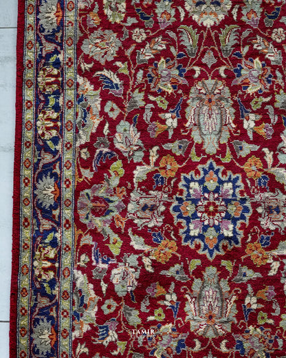 Central navy medallion and red floral field of the Chobi 3x5 rug