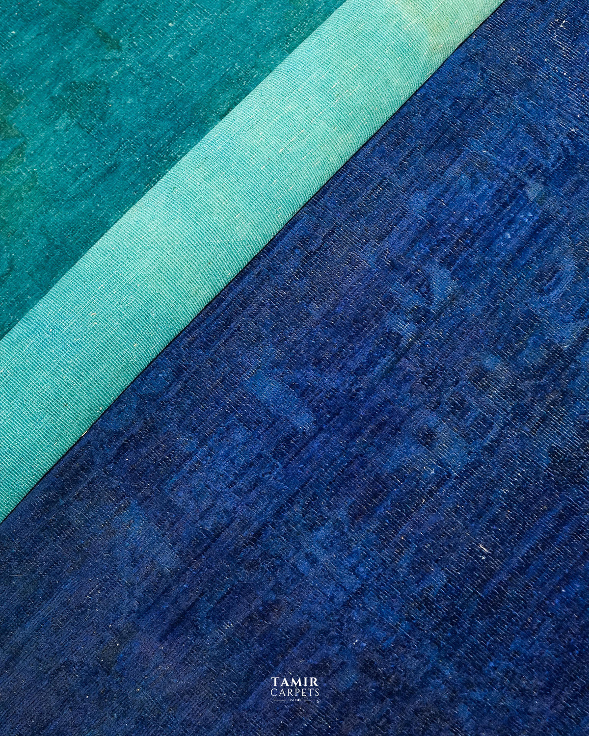 Close-up of the blue overdyed pile and backing on the handmade rug