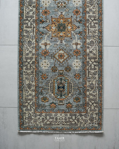 Top section of the Chobi Runner showing medallions and the ivory border