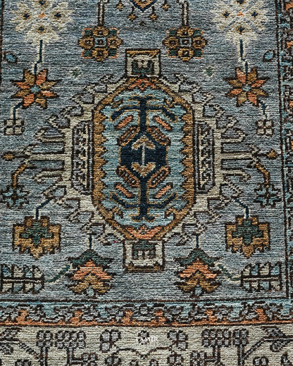 Close view of the rust and navy medallion on the grey Chobi Runner