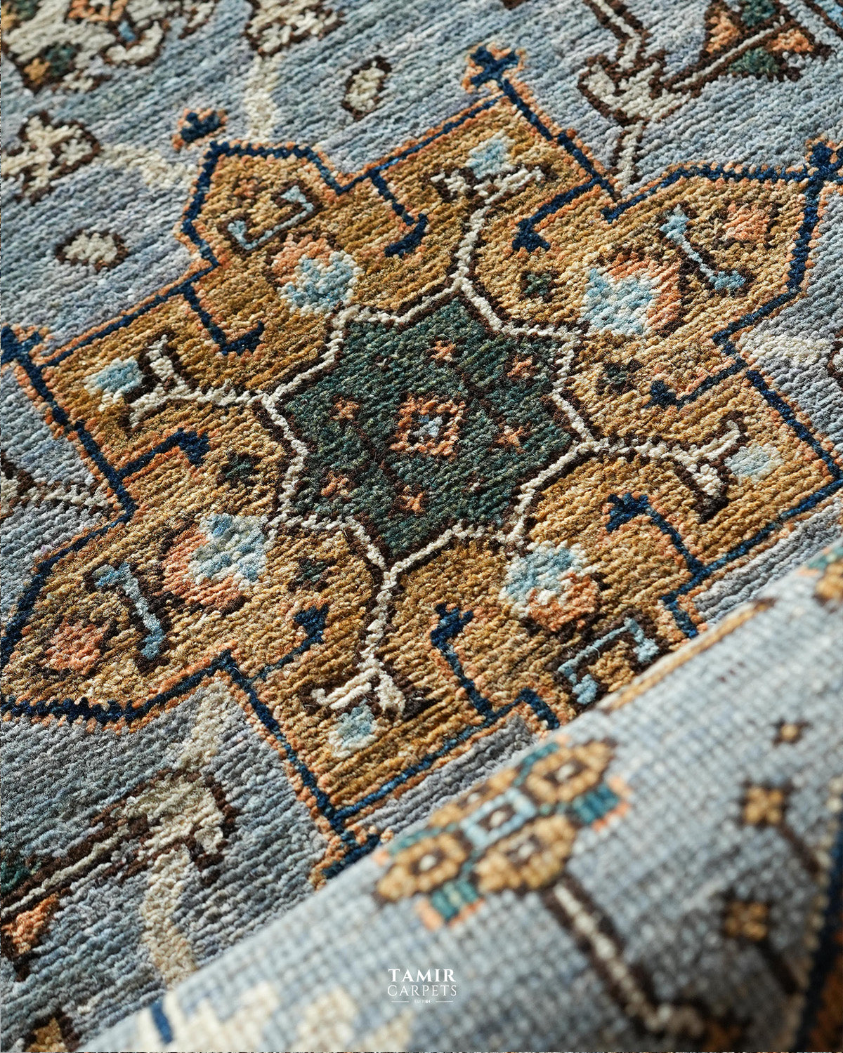Close-up of the green and sand medallion in organic-dyed handspun wool