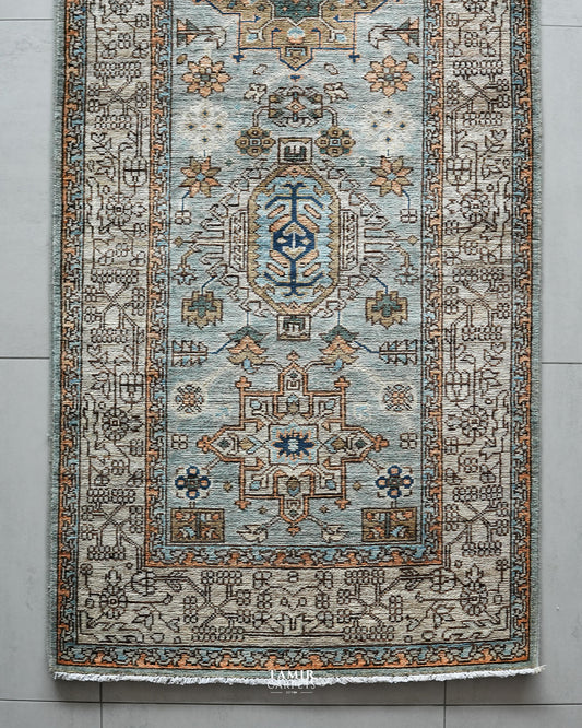 End section of the Chobi Runner showing medallions and the ivory geometric border