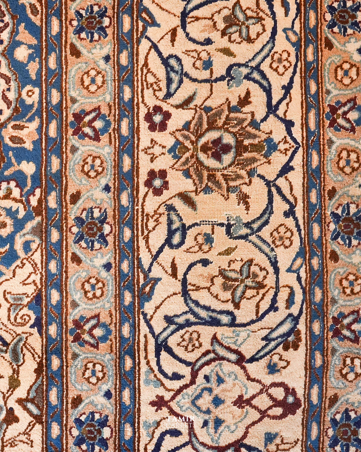 Detail of the scrolling floral border on the Ispahan Persian rug