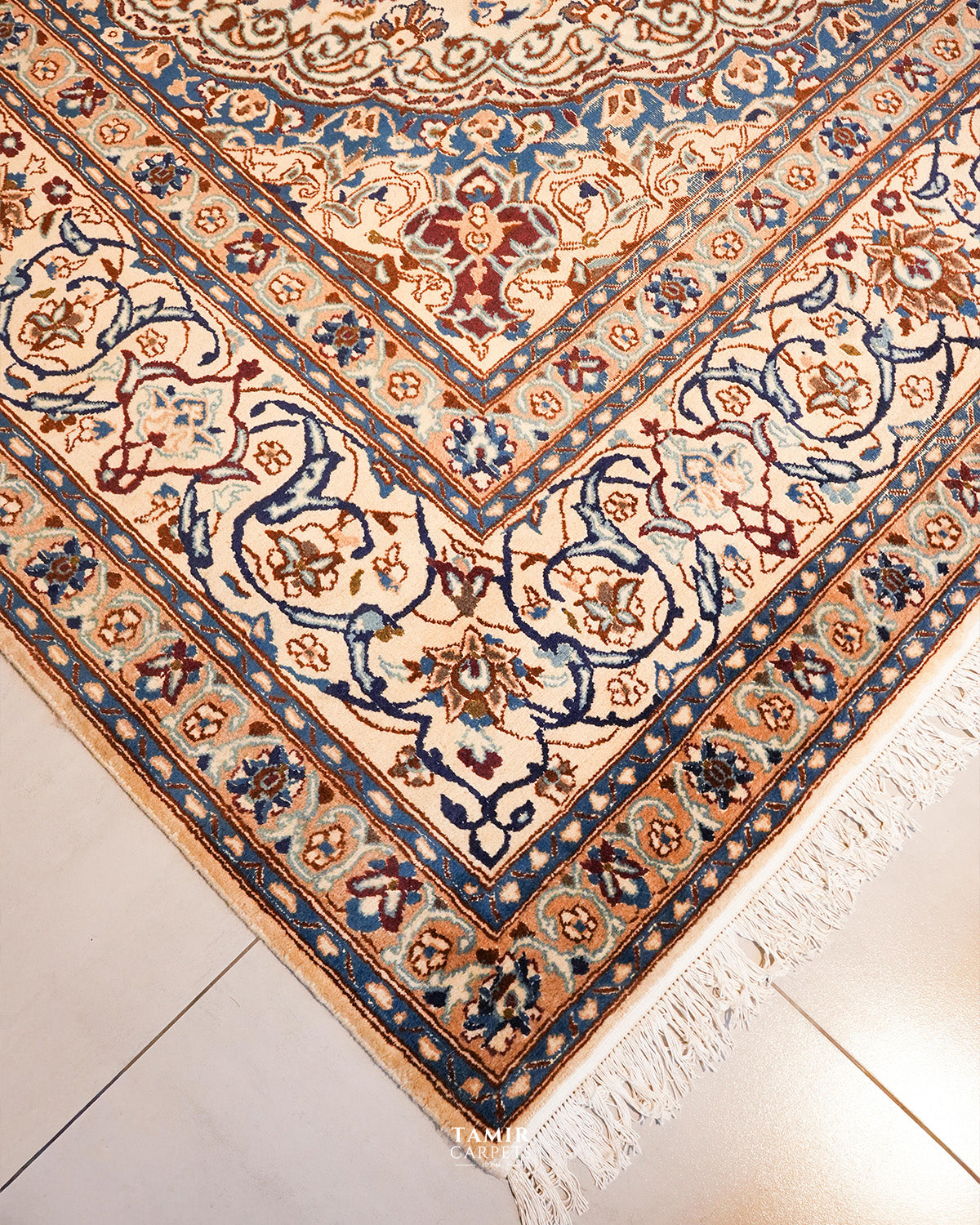 Angled corner view of the handmade Ispahan 9x12 rug with fringe