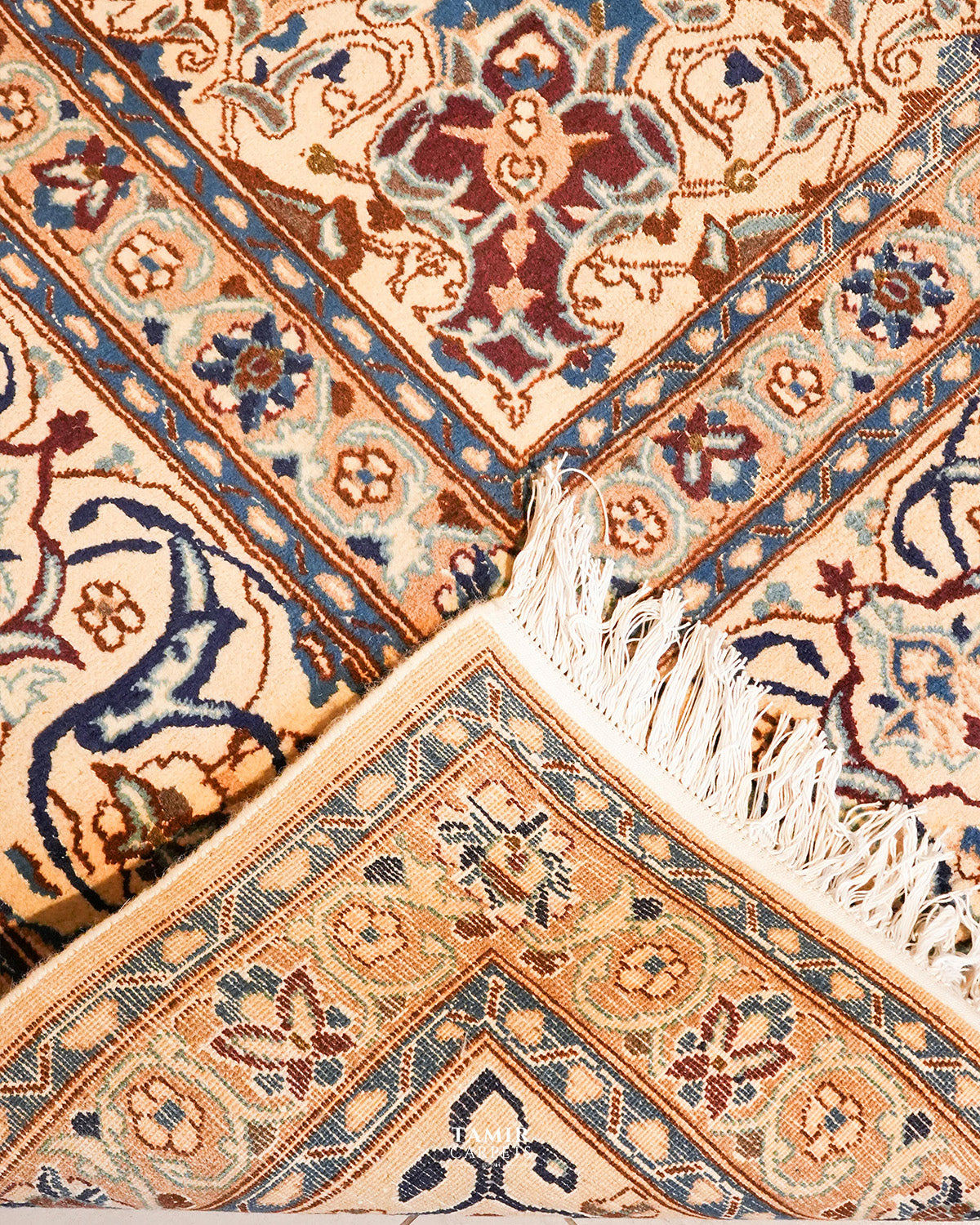 Folded corner showing the back weave of the double-knotted Ispahan rug