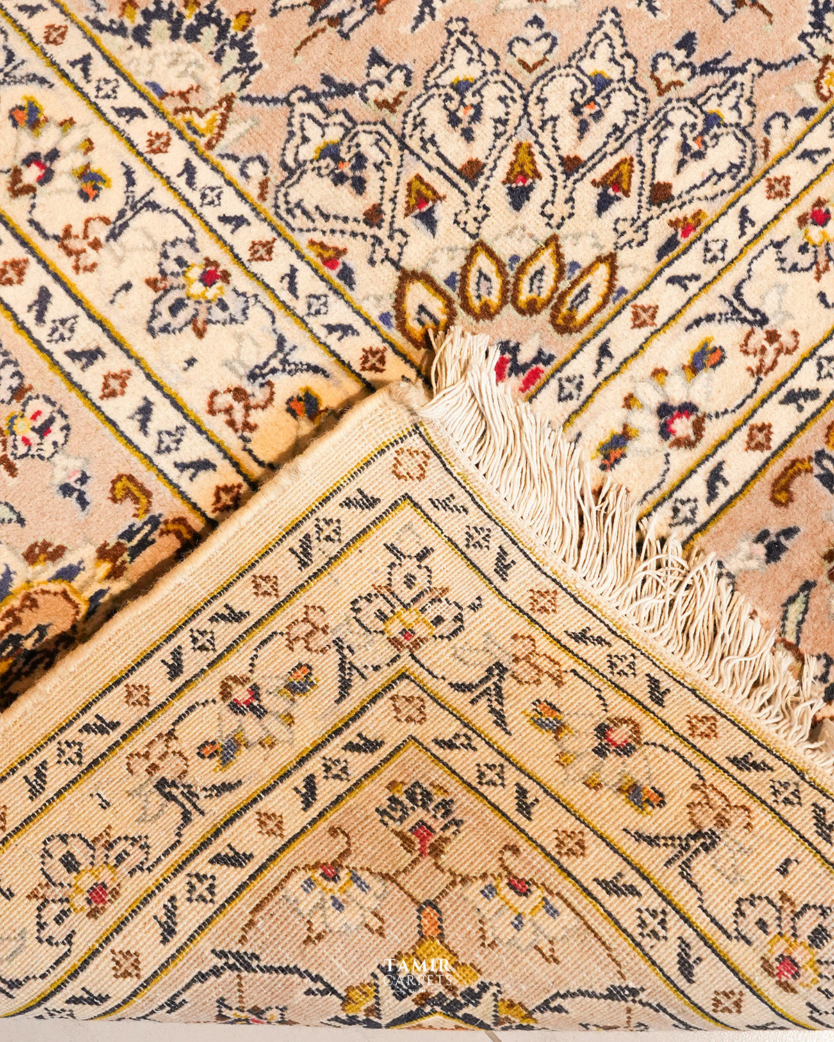 Folded corner showing the back weave of the double-knotted Kashaan rug