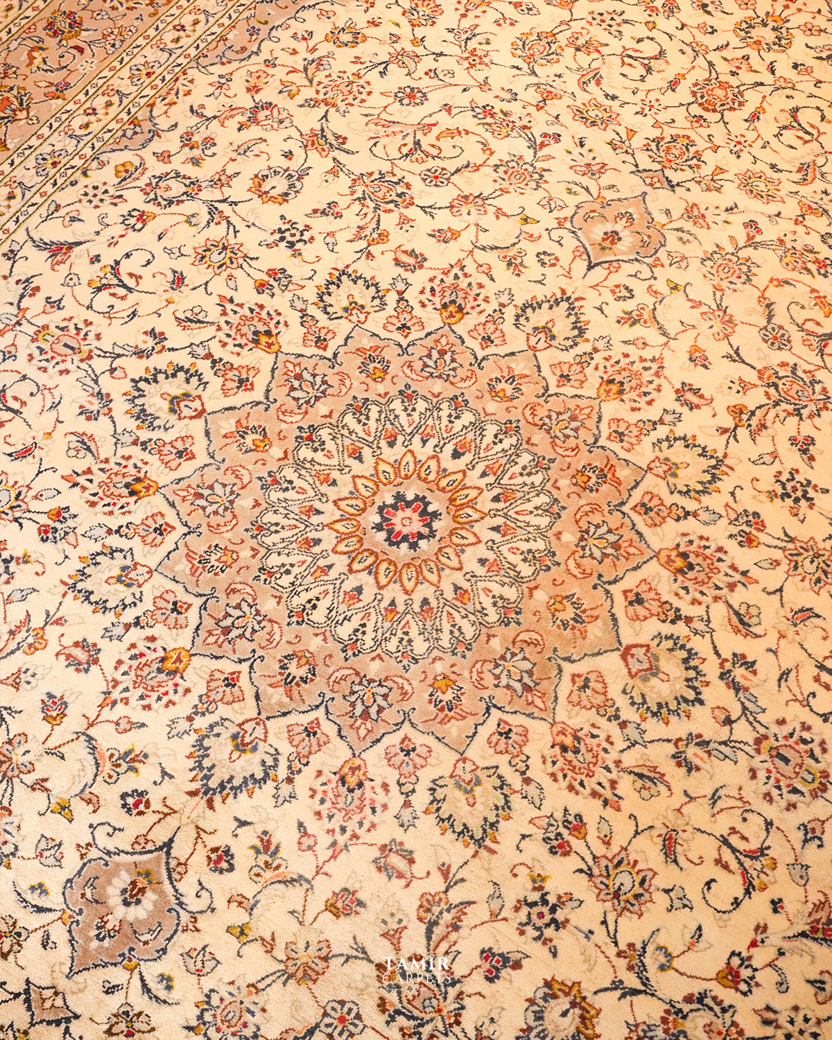 Blush and rose central medallion of the Kashaan Persian rug