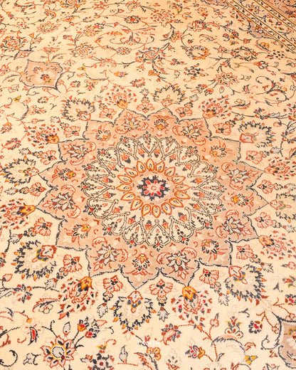 Close view of the medallion and floral scrolls on the ivory field