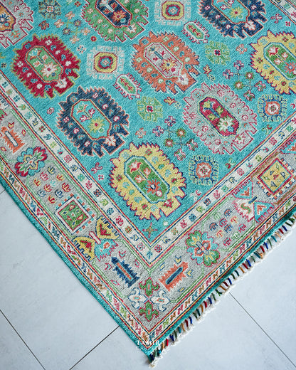 Angled corner view of the handmade blue Khurjeen rug