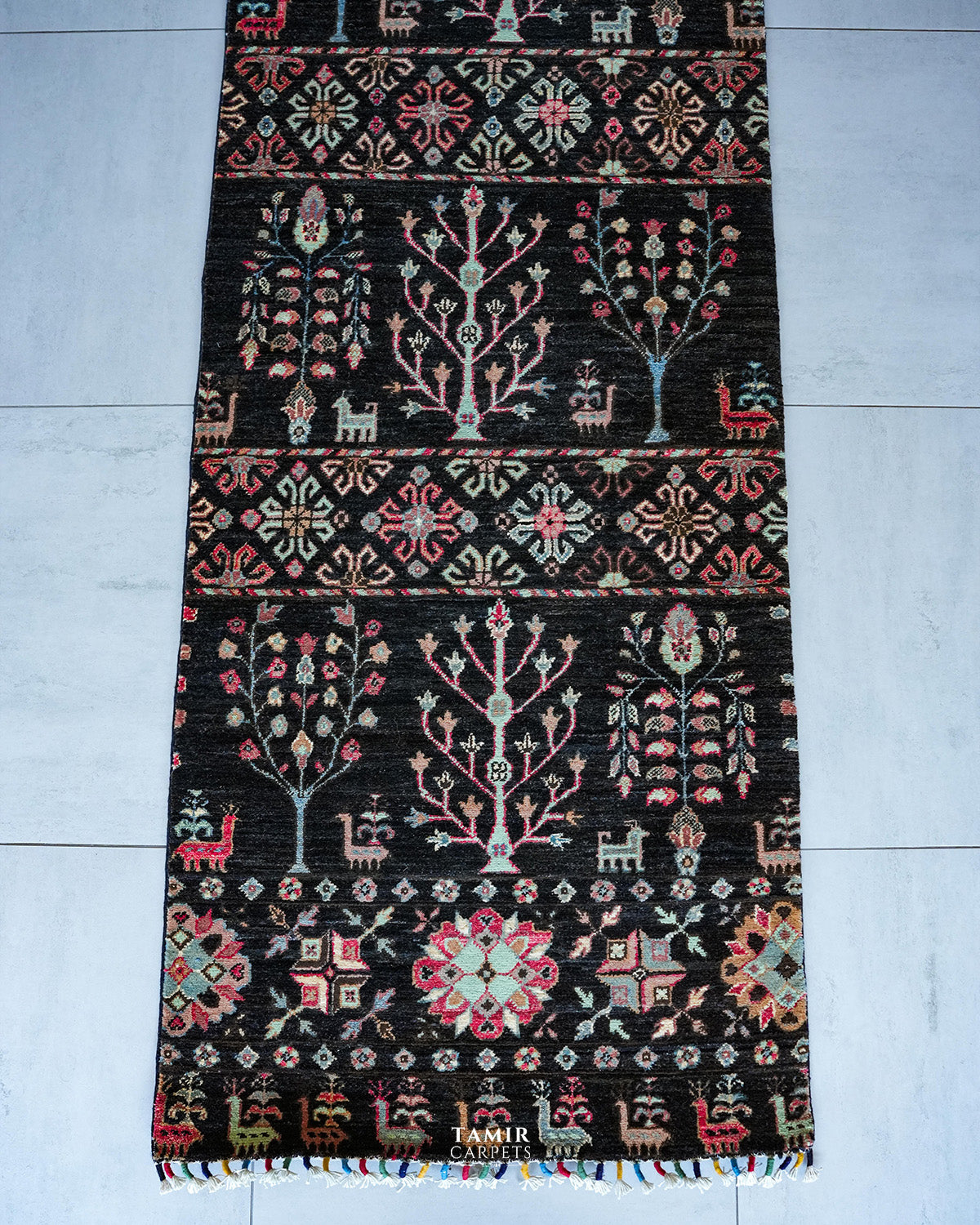 End section of the Khurjeen Runner with tree motifs and multicoloured fringe