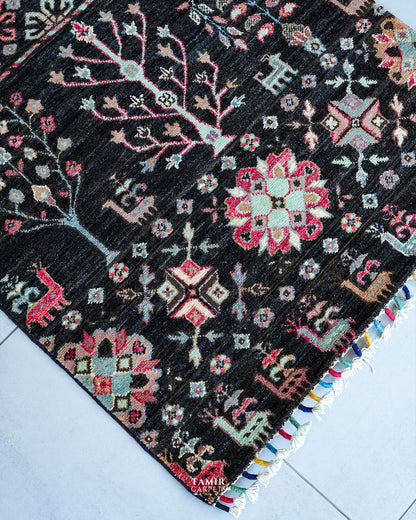 Pink and mint floral medallions in organic-dyed handspun wool on the Khurjeen Runner