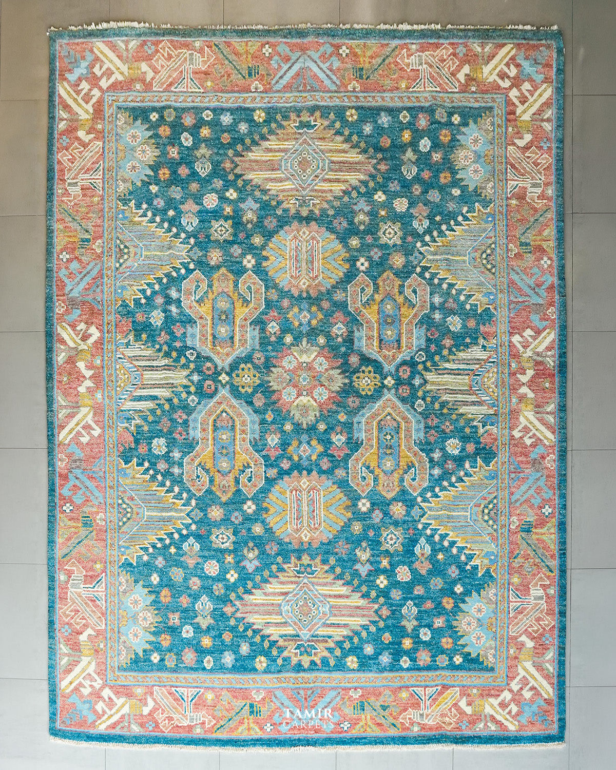 Oushak wool rug 9x12 ft, full view of the teal blue field and pink border