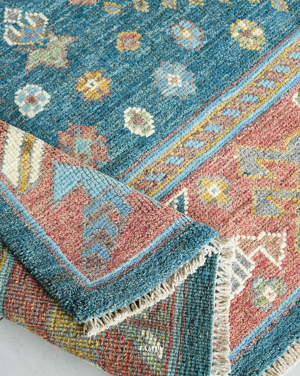 Rolled edge showing the thick organic handspun wool pile