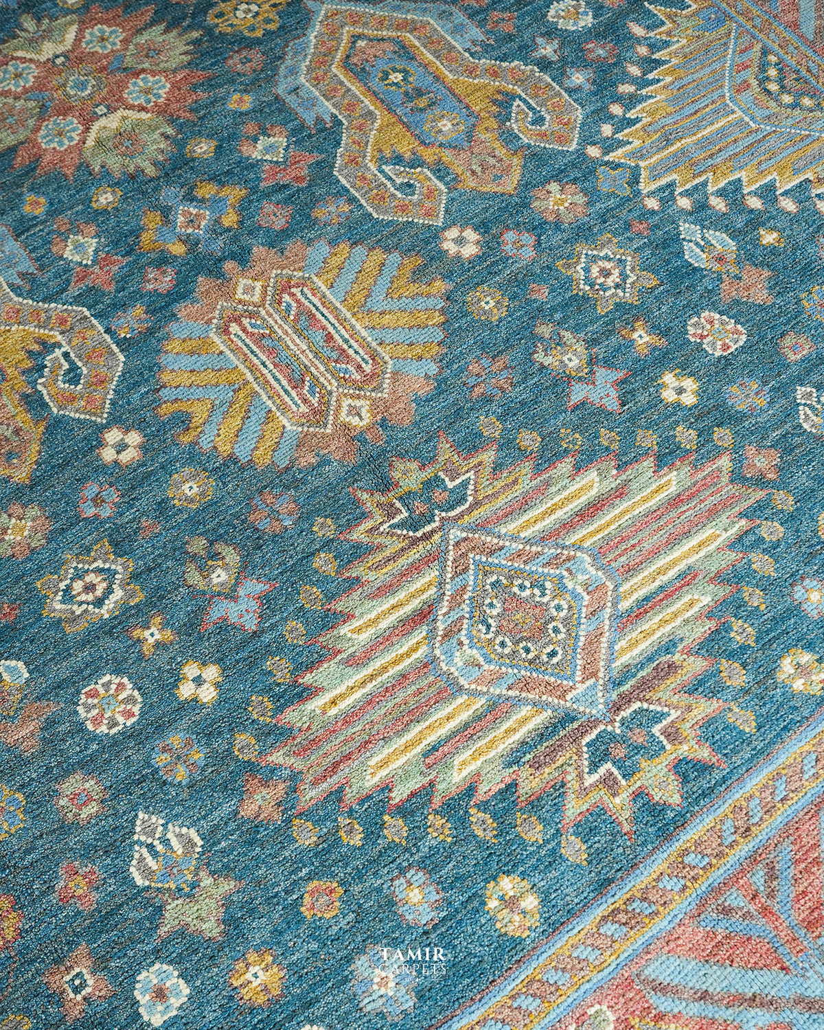 Close-up of the central geometric medallion in organic-dyed wool