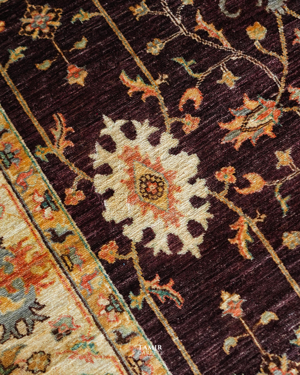 Cream and coral floral motifs in organic-dyed wool on the Oushak rug