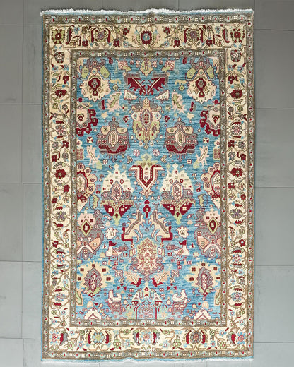 Sultanabad Afghan wool rug 6x9 ft, full view of the sky blue field and ivory border
