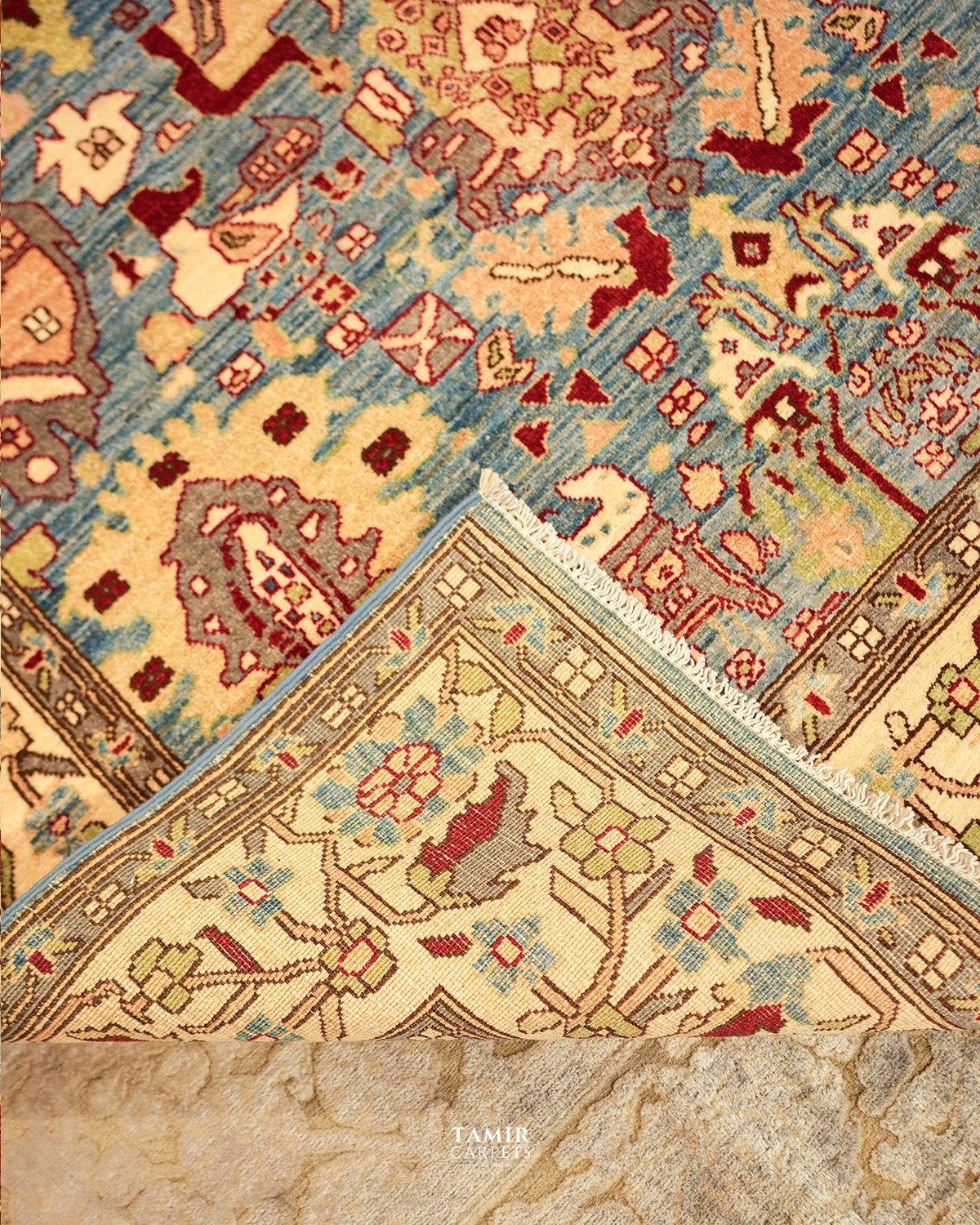 Folded section comparing front pile and back weave of the Sultanabad rug