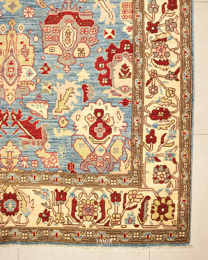 Corner of the Sultanabad 6x9 rug with the wide ivory floral border