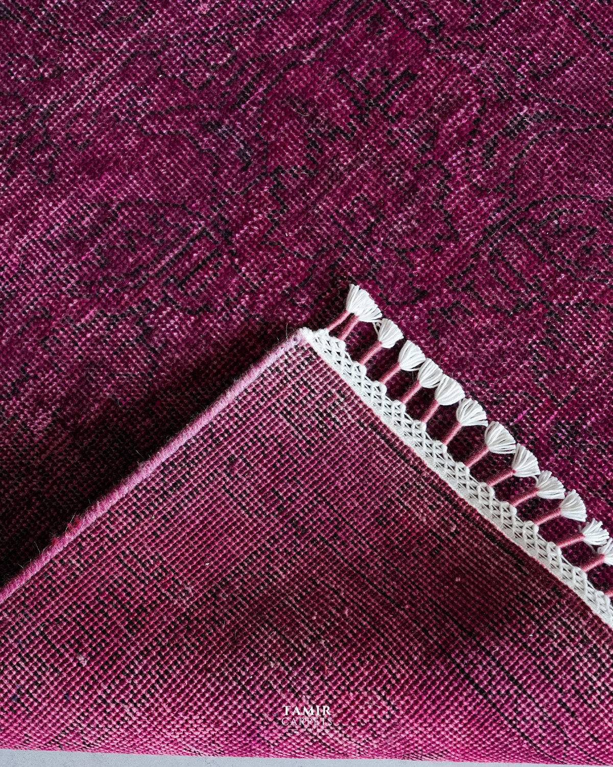 Folded corner showing the back weave of the double-knotted overdyed rug