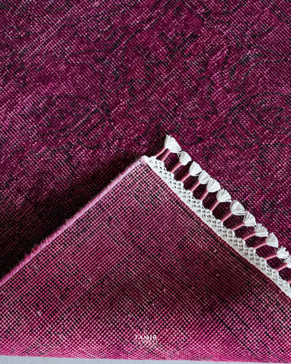 Folded corner showing the back weave of the double-knotted overdyed rug