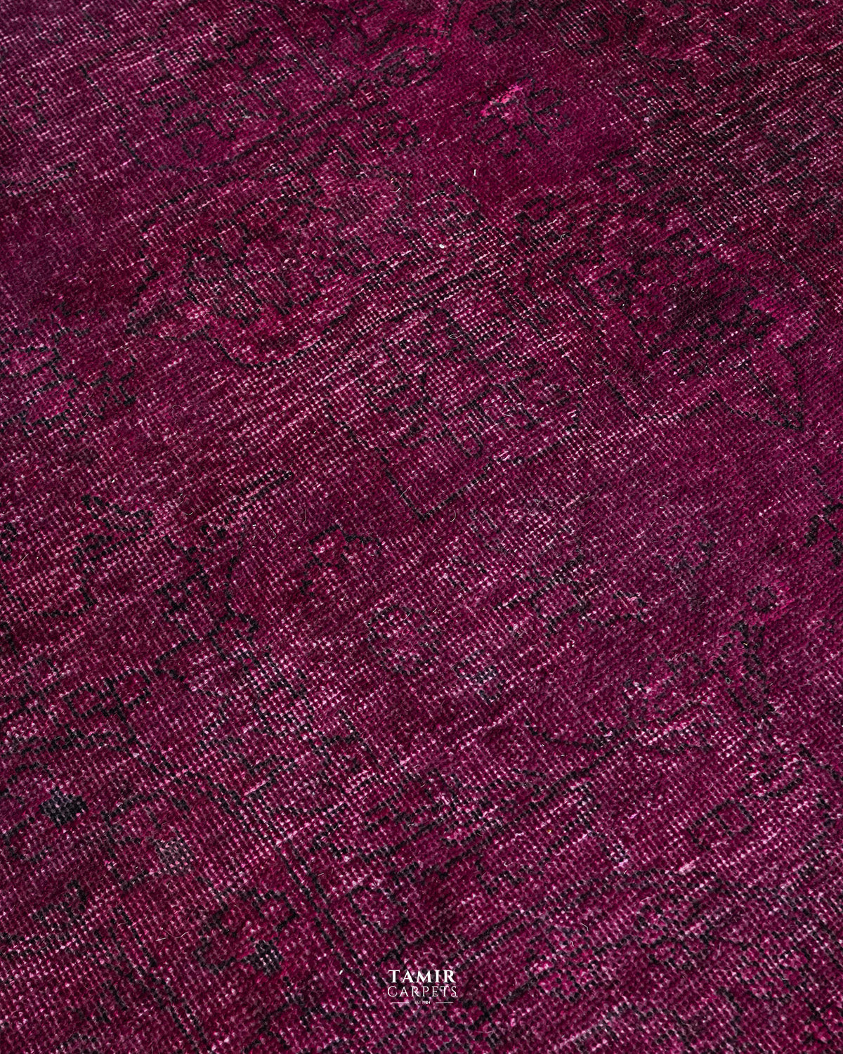 Close-up of the worn vintage texture on the overdyed wool rug