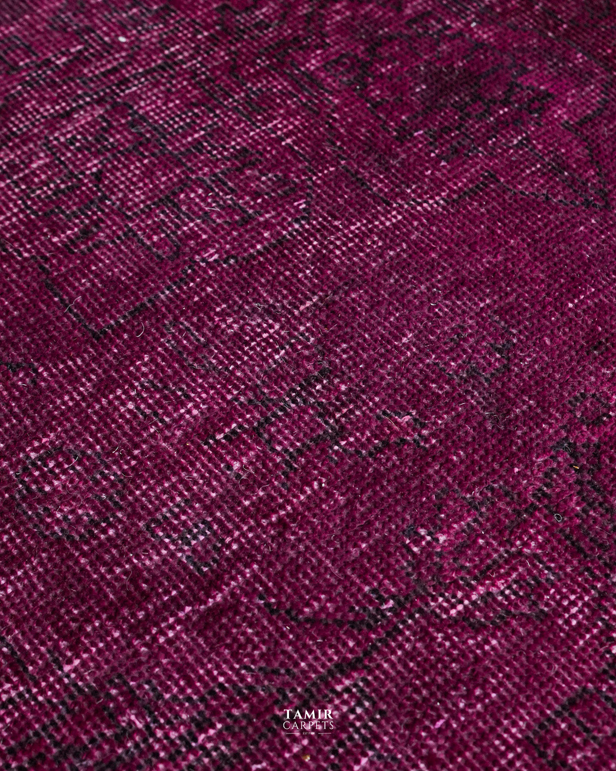 Detail of the organic handspun wool pile in magenta overdye